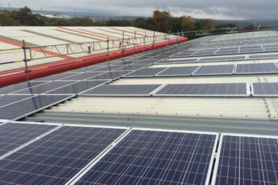 Solar panels on roof of building in business park in Manchester
