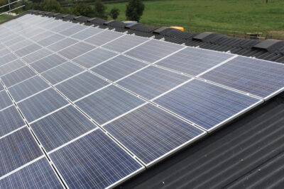 Solar panels on roof of industrial unit in Manchester