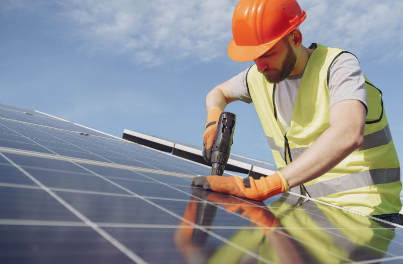 Man installing solar panel